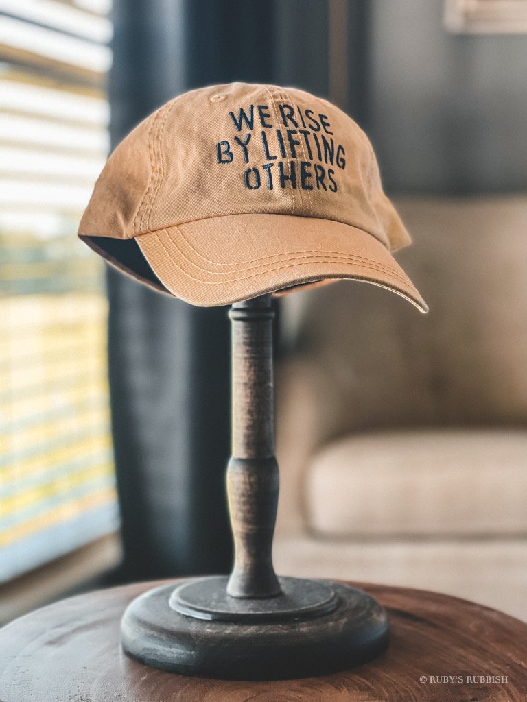 We Rise By Lifting Others Hat